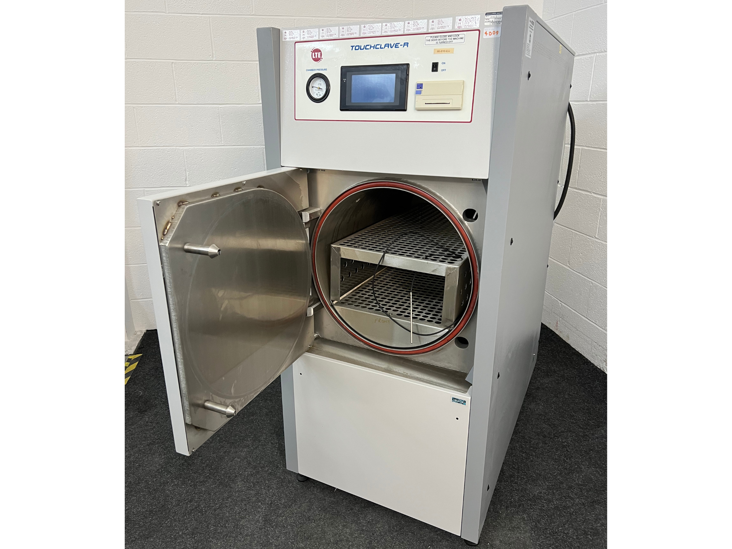 LTE Touchclave-R Autoclave with front door open and shelves in chamber